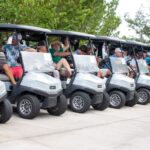 golf participants in carts