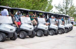 golf participants in carts