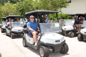 golf participants in carts