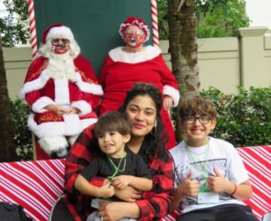 Family with Santa and Mrs. Clause at Santa Shoppe event